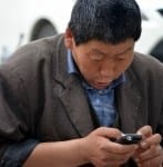 man repairing broken smartphone screen